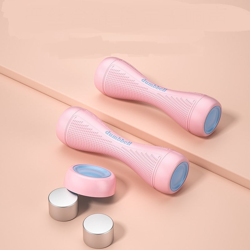 Pink dumbbells with blue caps on a beige background